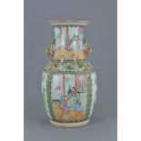 A Chinese Cantonese 19th century famille rose porcelain vase decorated with figures and floral patte