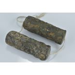 Two Bronze Cylindrical Roller Seals with relief decoration including figures and animals, 7cms high