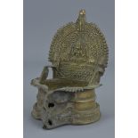 Eastern Bronze Oil Lamp with Seated Hindu God decoration, 13cms tall