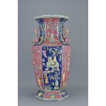A large Chinese 20th century porcelain vase decorated with potted plants and trees . 53Cm tall