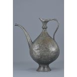 A large Islamic 19th century copper ewer incised decoration with birds. 35cm tall