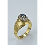 An 18ct gold and sapphire ring. Size N