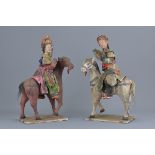 A pair of Chinese 19th century pottery horses and riders. 16cm x 30cm.