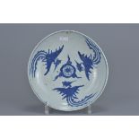 A Chinese 17th century blue and white porcelain dish late Ming dynasty decorated with three phoenix.