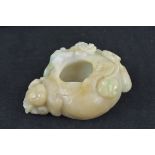 A Chinese jadeite brush washer carved with lion an