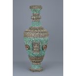 A large Tibetan silver-coloured metal vase inserted with turquoise stone decorated with lion  and Bu