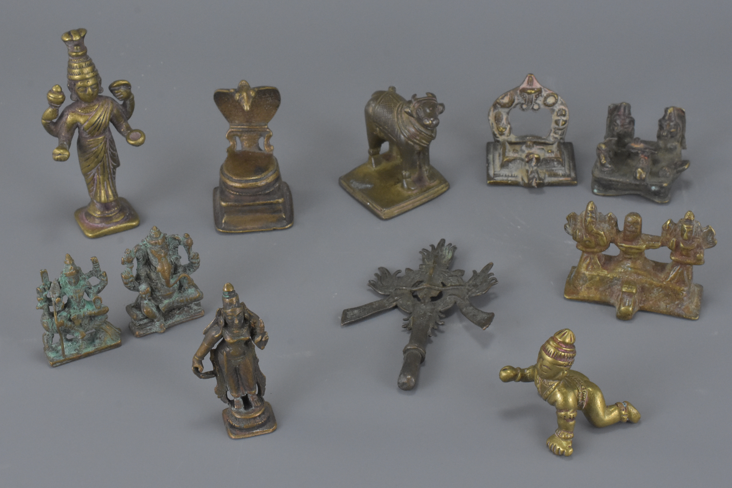 A group of eleven various Eastern bronze metal items. 2.5cm – 16cm