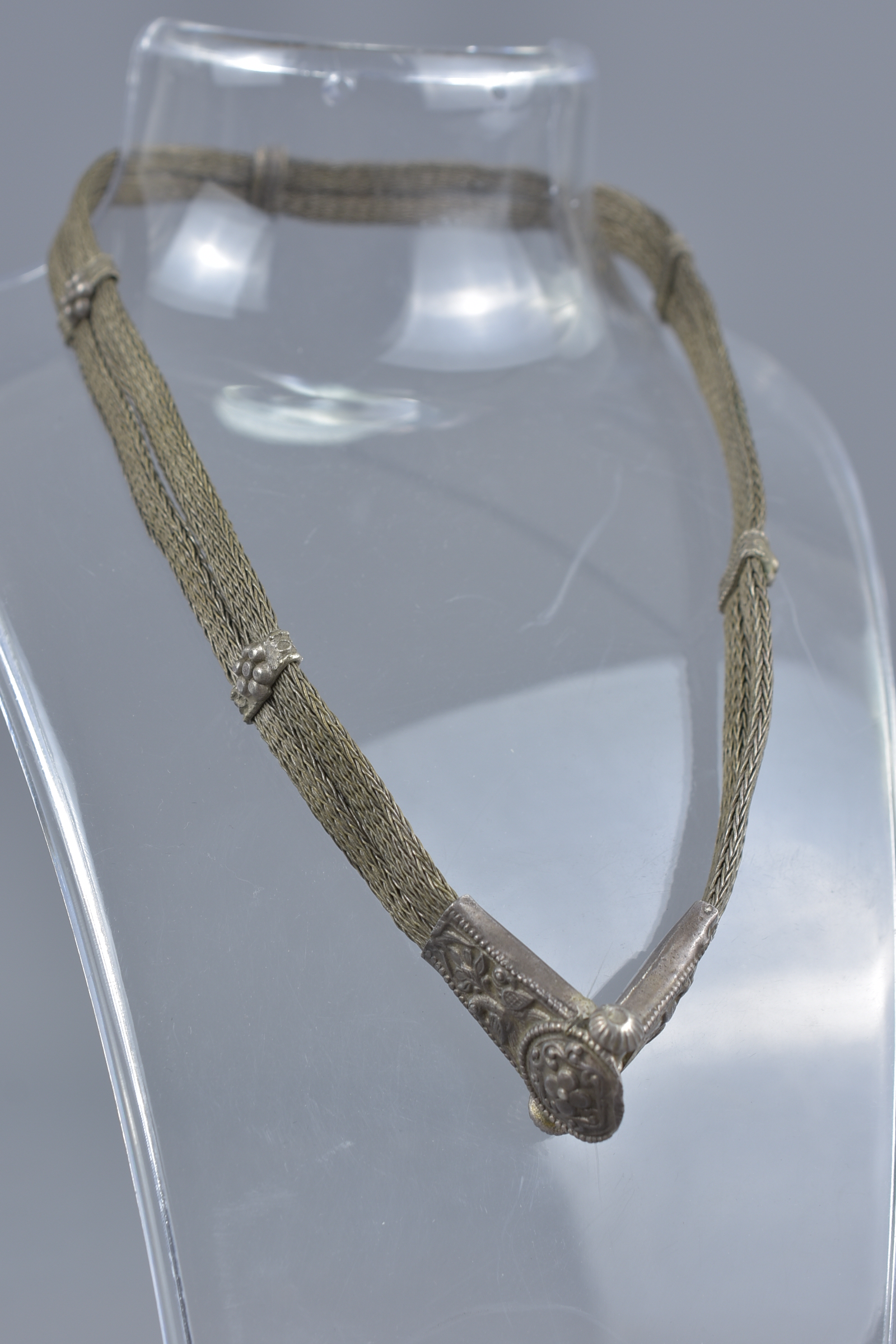 An Islamic 19th century metal chain item.