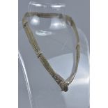An Islamic 19th century metal chain item.