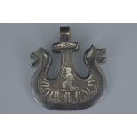 Indian Bronze Amulet in the form of a Twin Headed Mythical Creature and inlaid in white metal with a