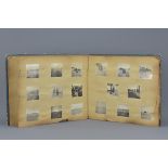 A collection of black and white photographs of Japanese World War II soldiers in an album with handw