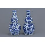 A pair of Chinese 19th century blue and white gourd-shape porcelain vases. 20Cm tall. (2)