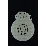 A Chinese white jade Bi Disc dragon pendant