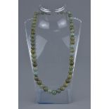A vintage jade bead necklace