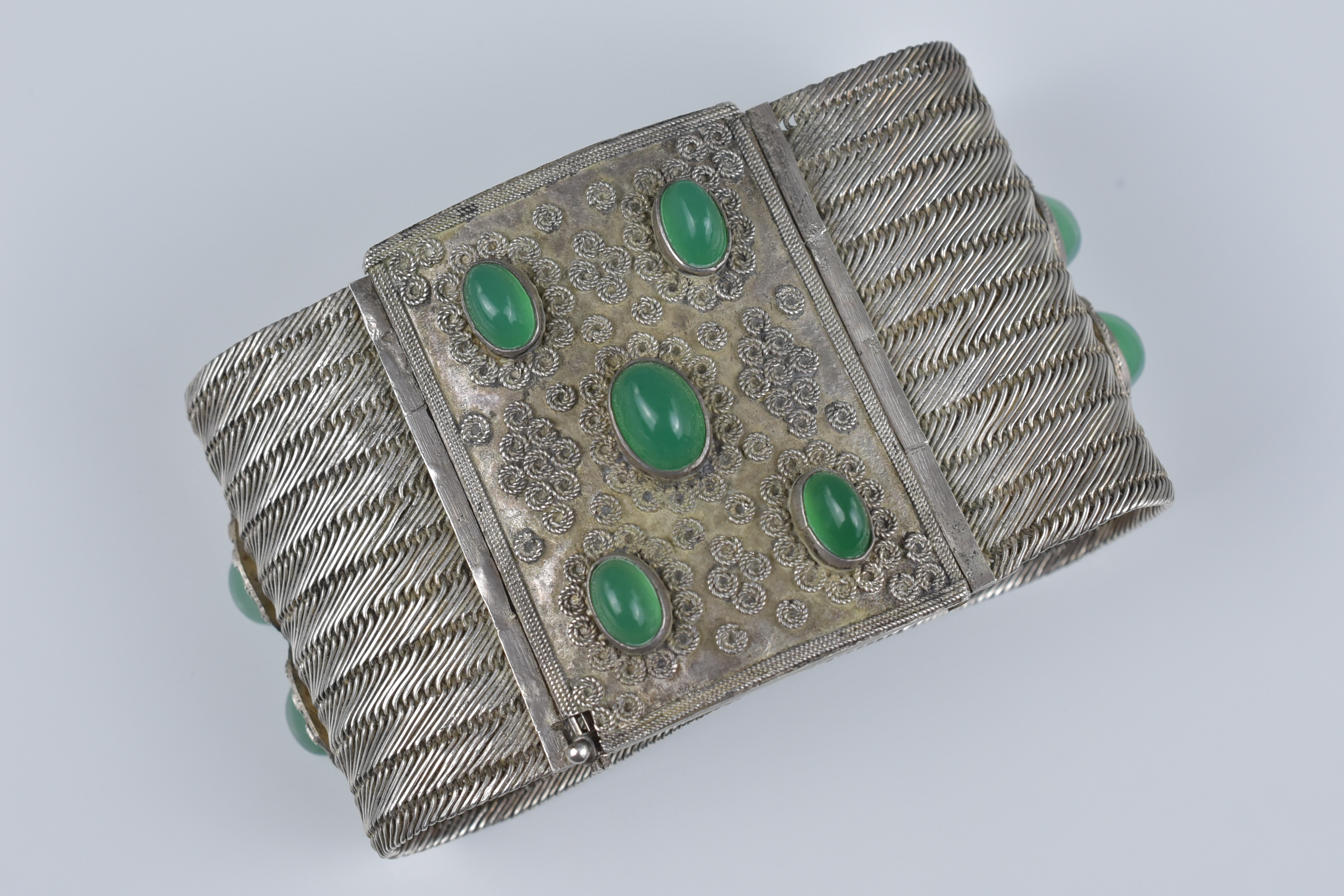 An antique silver metal and chrysoprase cuff bracelet