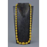 String of Yellow Amber Ovoid Beads