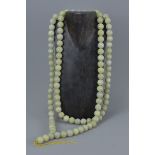 A large jade Chinese Buddhist bead necklace