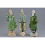 Three Chinese Ming dynasty green glazed figures