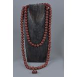 A large Chinese Buddhist agate beaded necklace