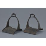 A pair of cast iron horse stirrups