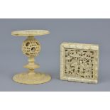 A Chinese 19th century carved ivory puzzle box and stand