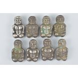 Eight White Metal Hollow Beads in the form of Men