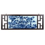 A Chinese 19th century porcelain plaque in hardwood frame