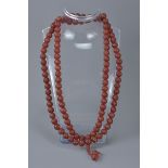 Long String of approximately 110 Red Polished beads