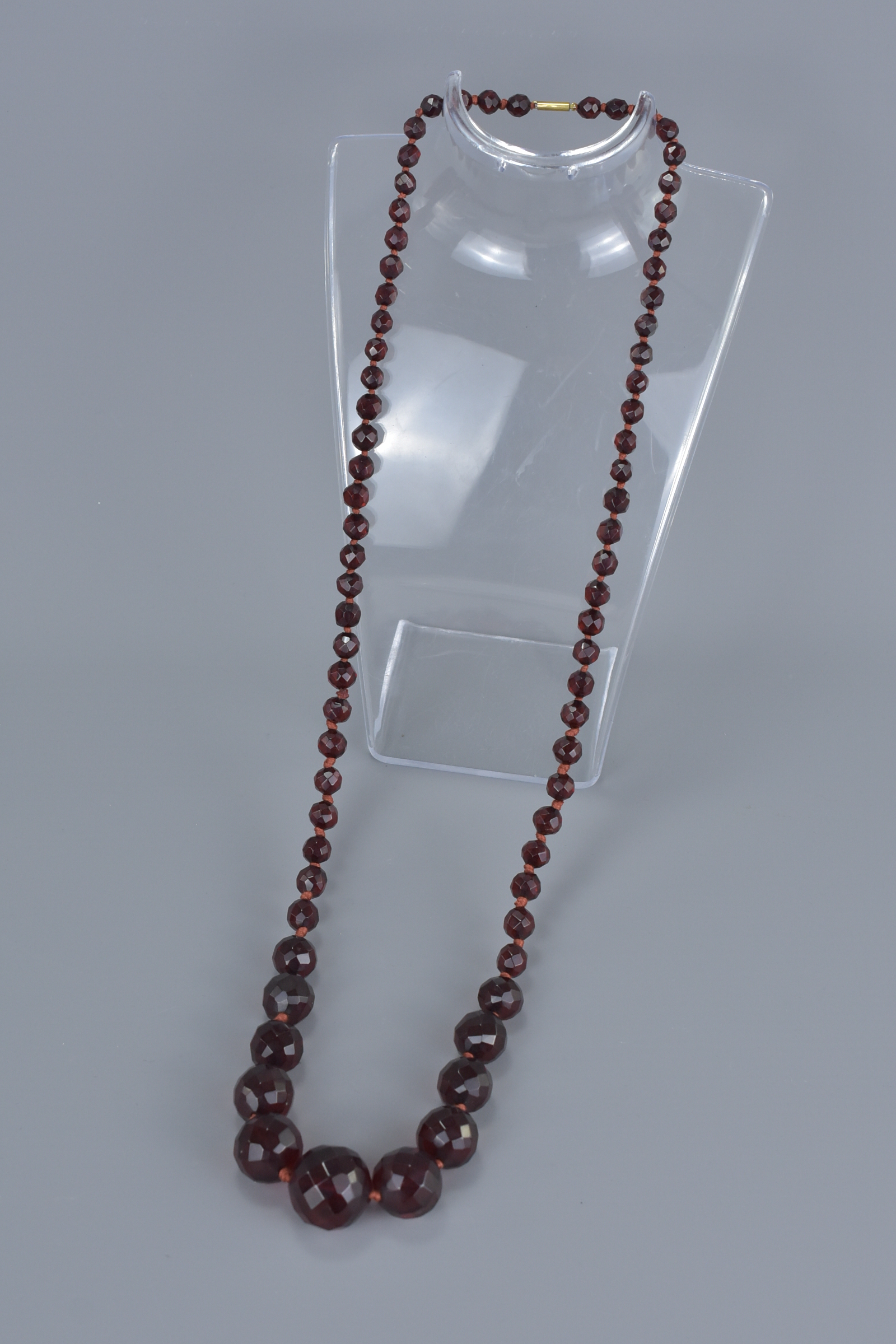 String of Seventy Three Faux Cherry Amber Faceted beads - Image 2 of 3