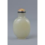 A Chinese 19th century white jade snuff bottle