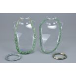 Two jade bead necklaces together with a jade bangle with white metal clasps with one other bangle. (