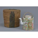 Chinese 19th century Cantonese Teapot contained in a fitted Wicker Container, 14cms high