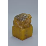 Chinese Soapstone Seal surmounted by a Curled Chilong fitted in a Silk Box, 5.5cms high