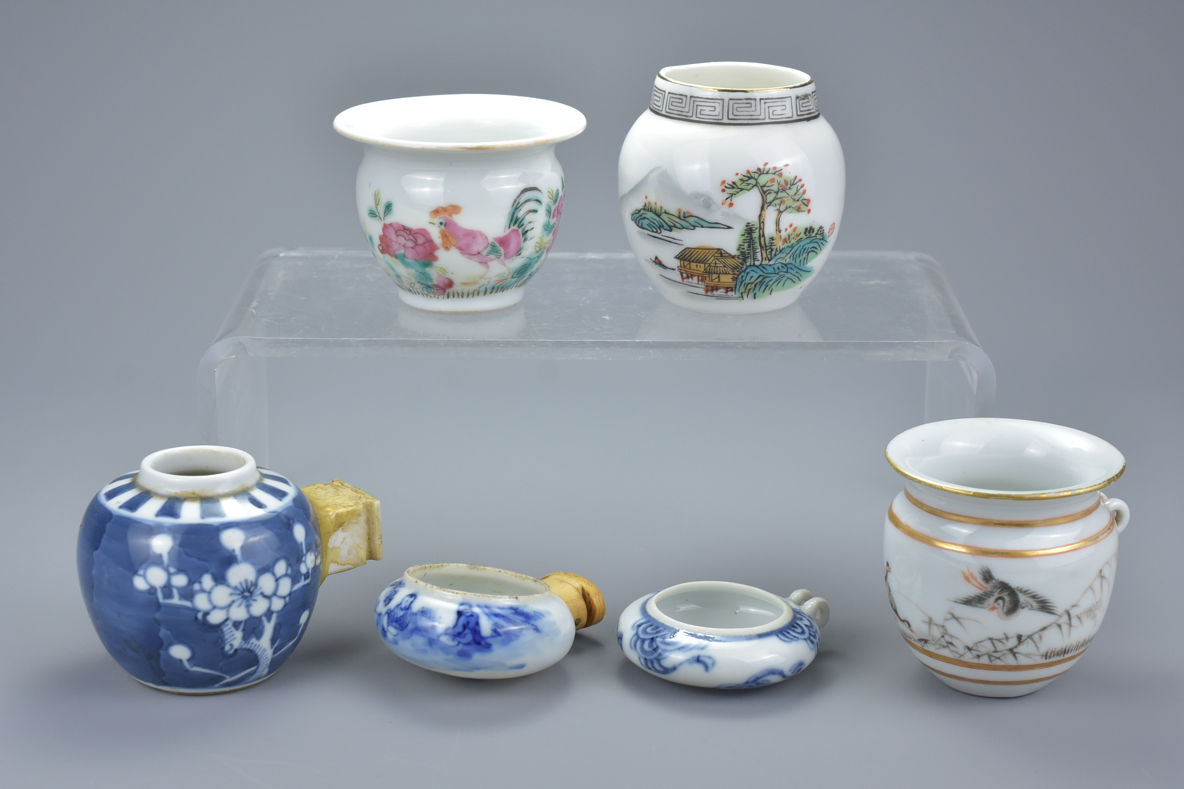 Six Chinese Late 19th century Porcelain Bird Feeders including Two Blue and White examples, Three Fa