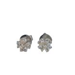 A pair of diamond stud earrings each with four hea