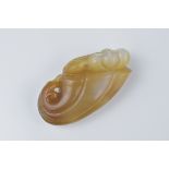 A Chinese carved agate pendant of a duck on lotus leaf. 5cm length