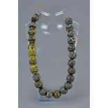 Twenty Four Antique Islamic Glass Beads (24)
