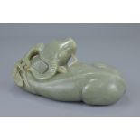 A Large Chinese Hetian Celadon Jade Carving of a Water Buffalo, 19th century or earlier, 24cms long