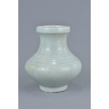 A Chinese 14th century Yuan dynasty Shufu type porcelain jar with lined decoration. 13cm tall