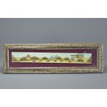 A painted celluloid plaque of Isfahan city, Iran showing polo players. Mounted in frame. Frame 49cm