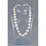 A cultural pearl necklace with gold clasp stamped 750