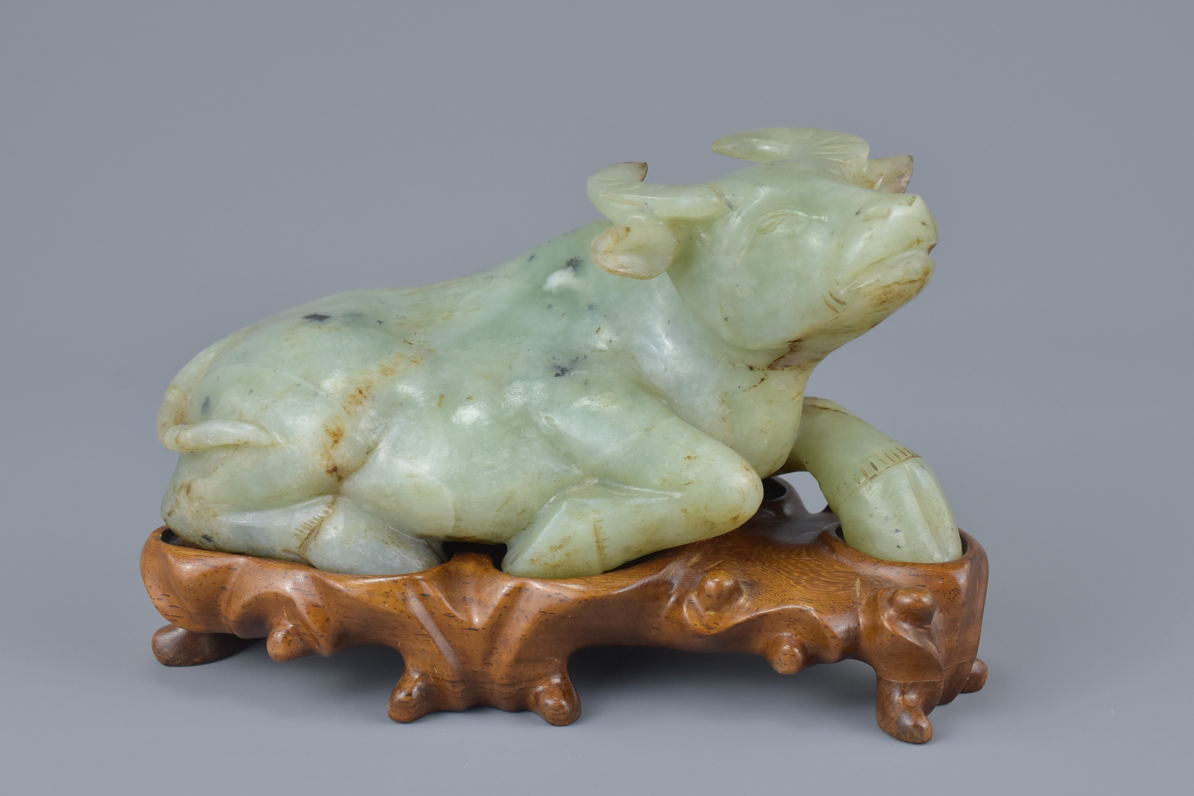 Chinese carved Celadon Jade Ox on a Carved Rosewood Stand, 16cms long