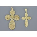 Two 19th century Ivory Crosses, one carved with Flowers, 10cms high and the other with Lily of the V