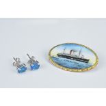 An enamel on metal brooch painted with a ship R.M.S Antonia together with a pair of vintage stud ear
