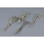 18th / 19th century Silver Plated Candle Snuffer Scissors together with Two Silver Plated Grape Scis