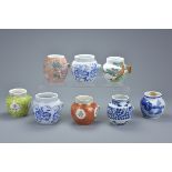 Eight Chinese Early 20th century Porcelain Bird Feeders including Four Blue and White examples and a