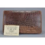 A vintage crocodile leather clutch bag in very good condition. Made in Singapore.