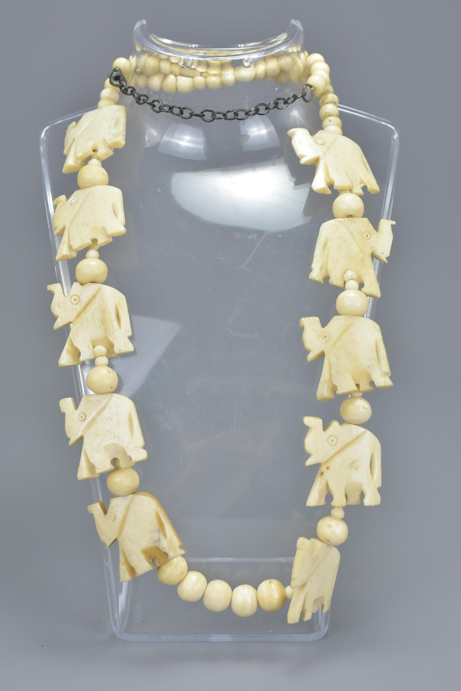 Three carved bone necklaces. (3) - Image 2 of 3