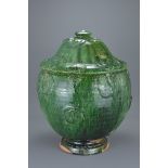 Large Chinese Song / Yuan Dynasty Glazed Buddhist Jar. The exterior coated in a dark green glaze, th