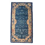 A Chinese 19th century woven blue ground prayer rug